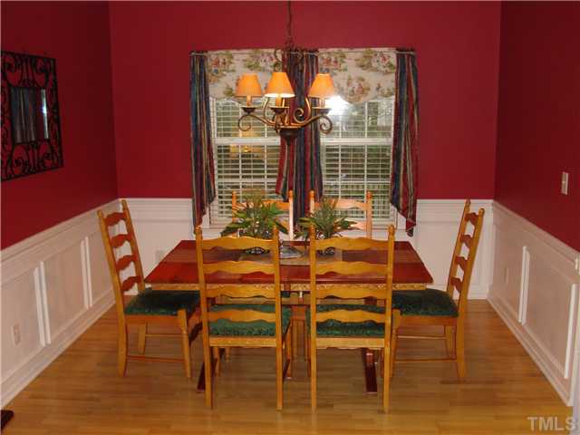 5505 Enoree Lane Raleigh, NC 27616 - Photo 4 of 12 Formal Dining Room with chair railing and lots of crown moulding.