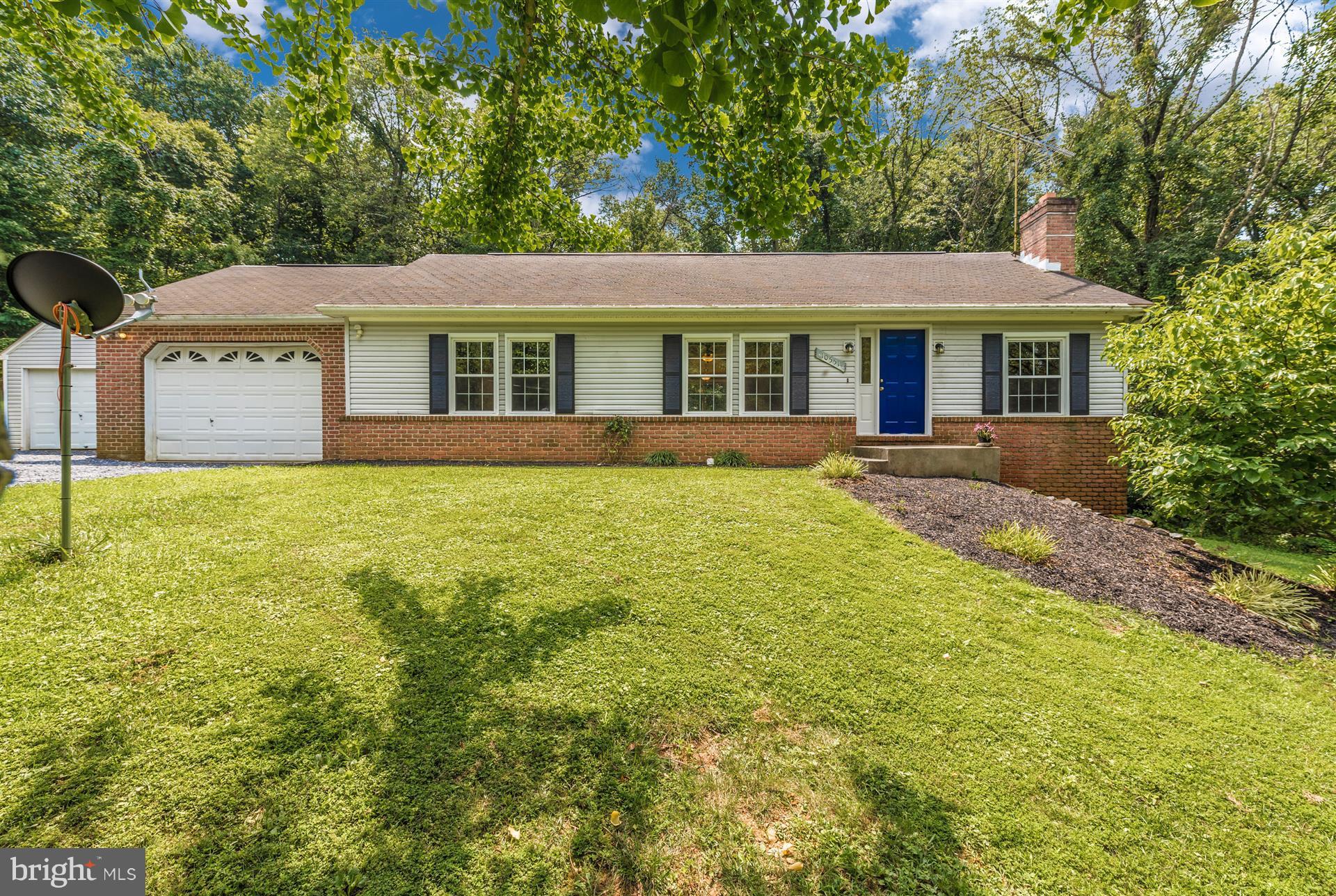 10551 Rum Springs Road Frederick, MD 21702 - Photo 1 of 24 a front view of a house with yard and green space