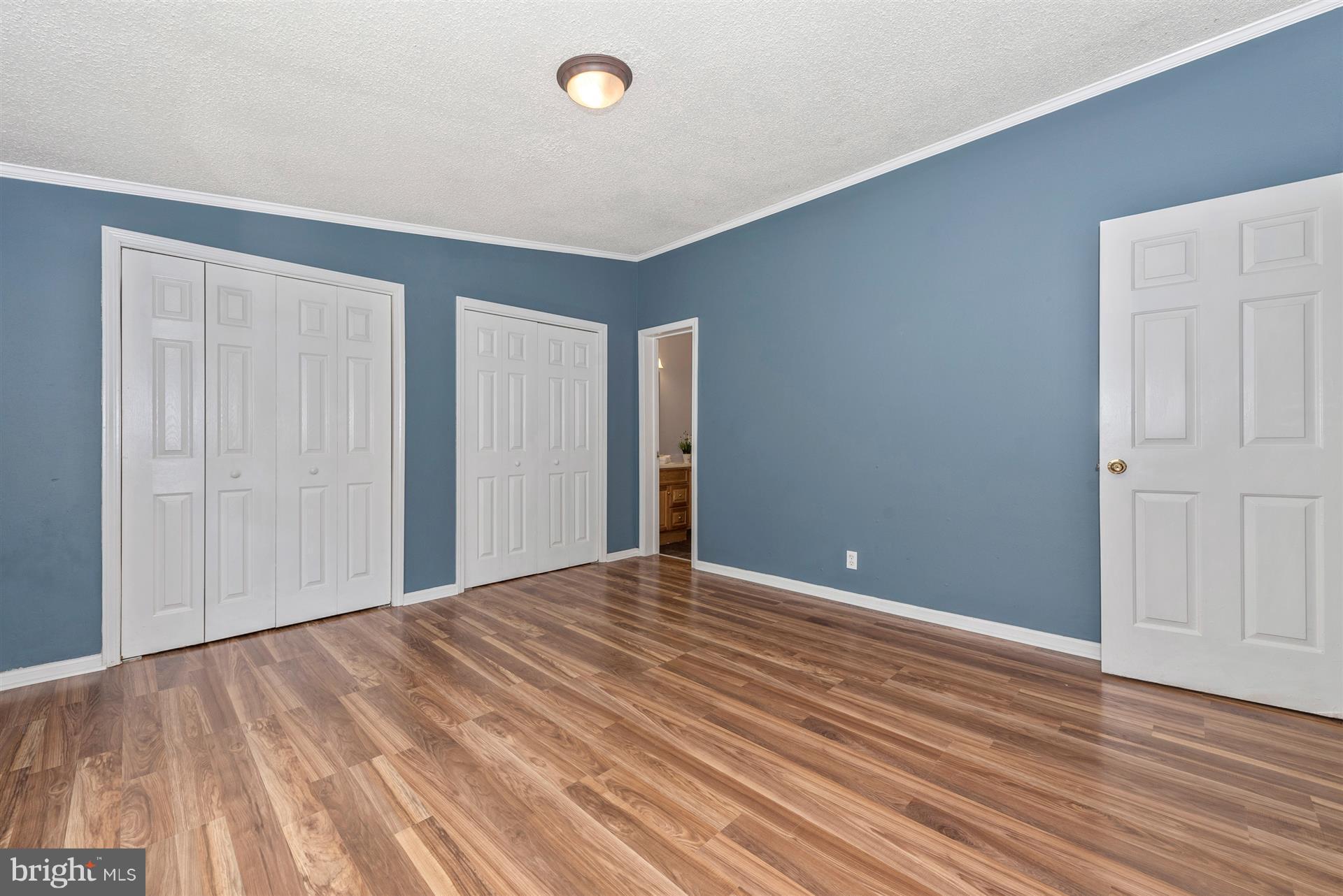 10551 Rum Springs Road Frederick, MD 21702 - Photo 14 of 24 a view of empty room with wooden floor