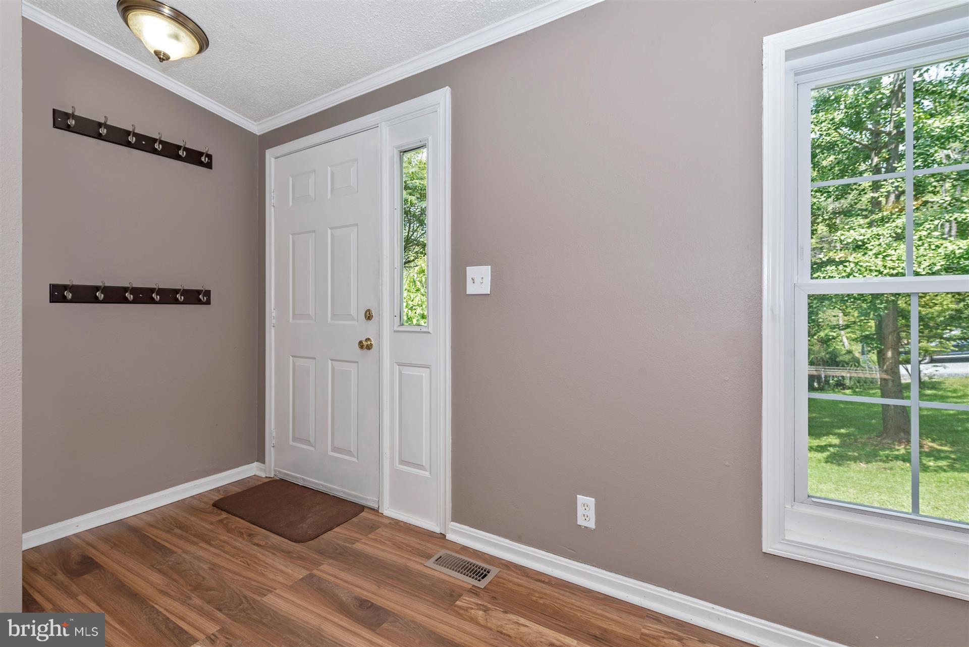 10551 Rum Springs Road Frederick, MD 21702 - Photo 3 of 24 a view of an empty room with a window