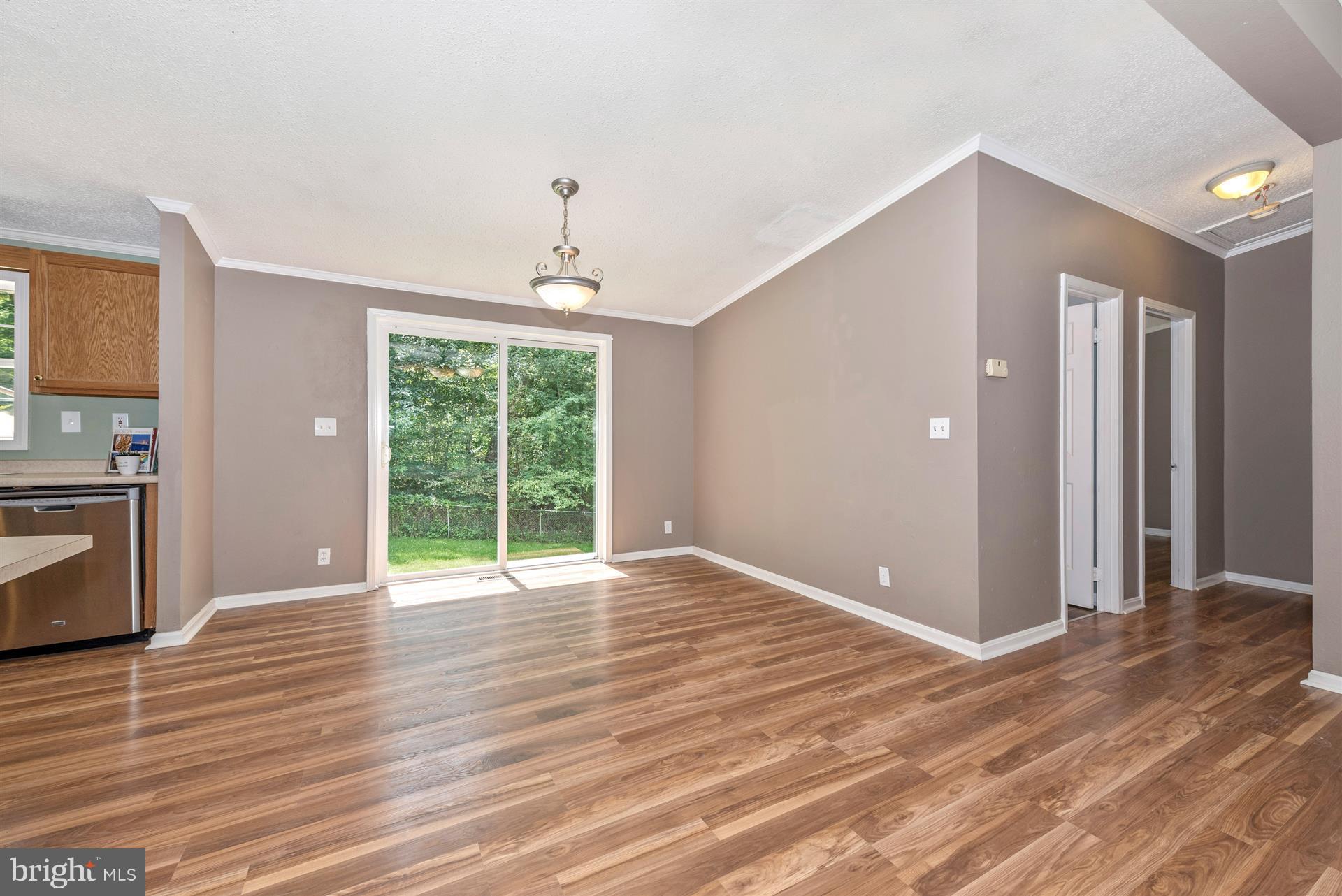 10551 Rum Springs Road Frederick, MD 21702 - Photo 4 of 24 a view of an empty room with a window and wooden floor