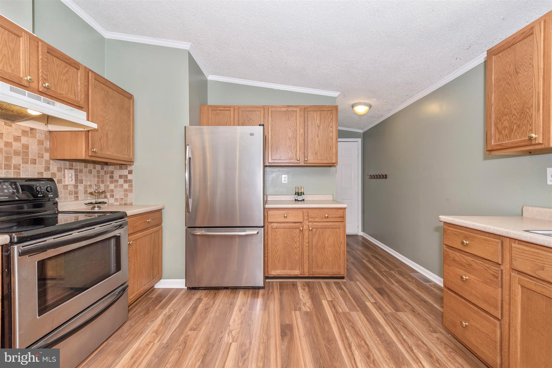10551 Rum Springs Road Frederick, MD 21702 - Photo 9 of 24 a kitchen with a refrigerator stove and sink