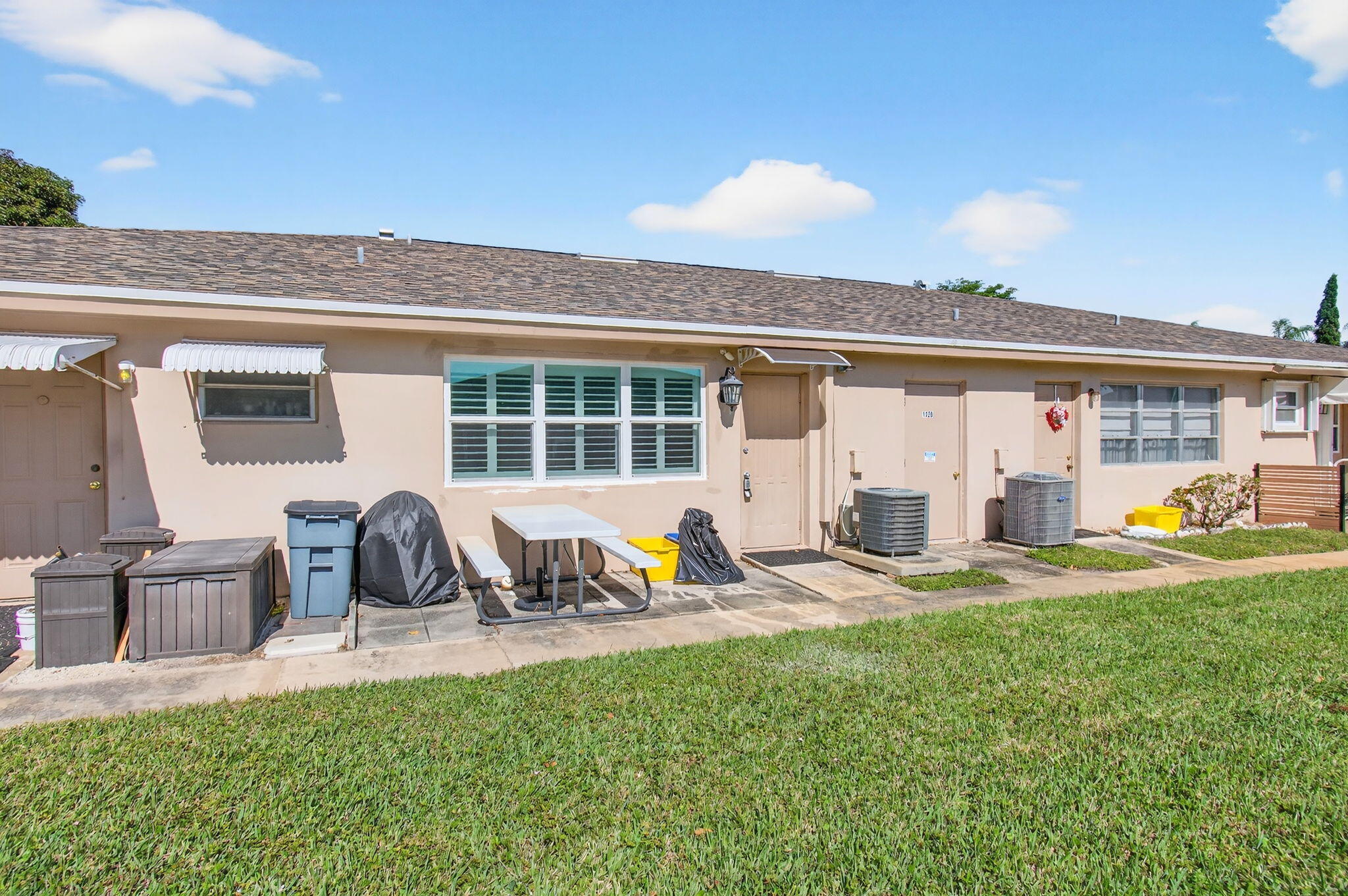 1320 High Point Place South, Unit C Delray Beach, FL 33445 - Photo 40 of 56 Patio and back yard exterior view (1)