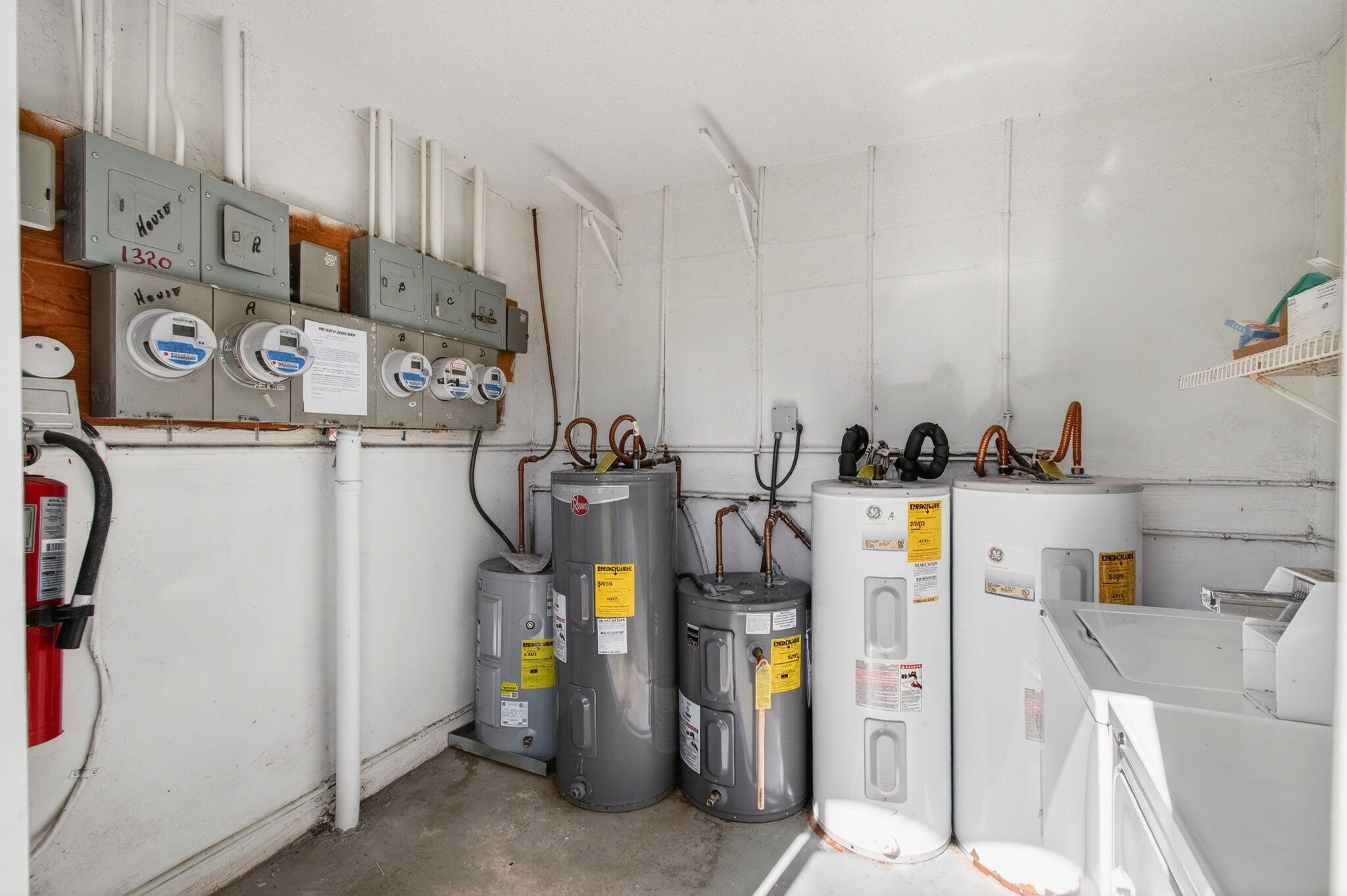 1320 High Point Place South, Unit C Delray Beach, FL 33445 - Photo 43 of 56 Laundry room and hot water tanks (1)