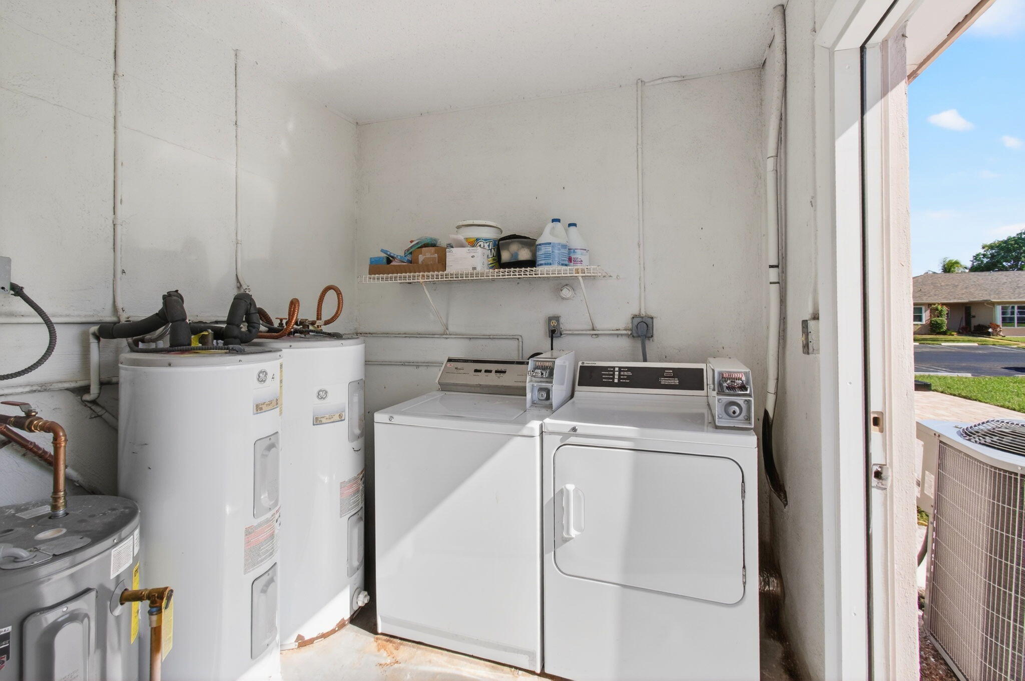 1320 High Point Place South, Unit C Delray Beach, FL 33445 - Photo 44 of 56 Laundry room and hot water tanks (2)