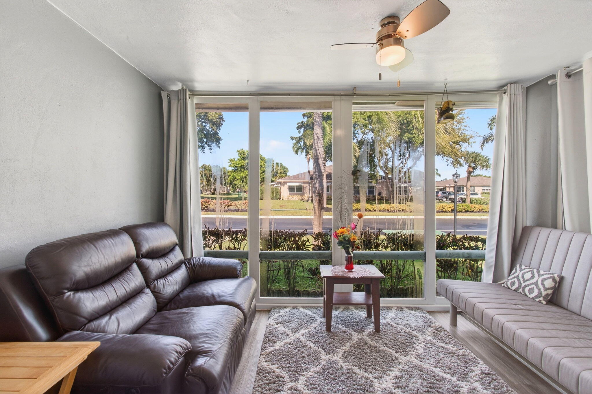 1320 High Point Place South, Unit C Delray Beach, FL 33445 - Photo 5 of 56 Enclosed Florida room under air (3)