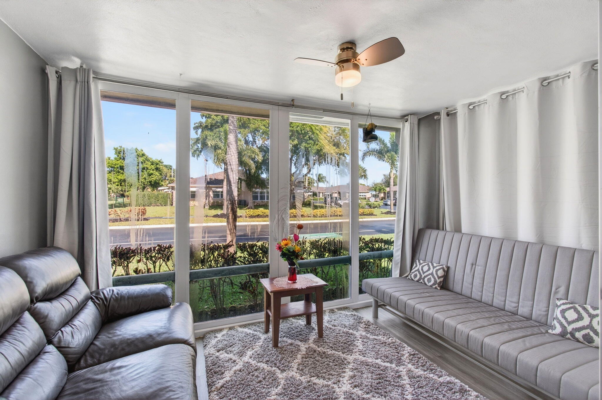 1320 High Point Place South, Unit C Delray Beach, FL 33445 - Photo 7 of 56 Enclosed Florida room under air (2)