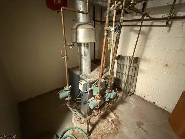 a view of city street with parked cars