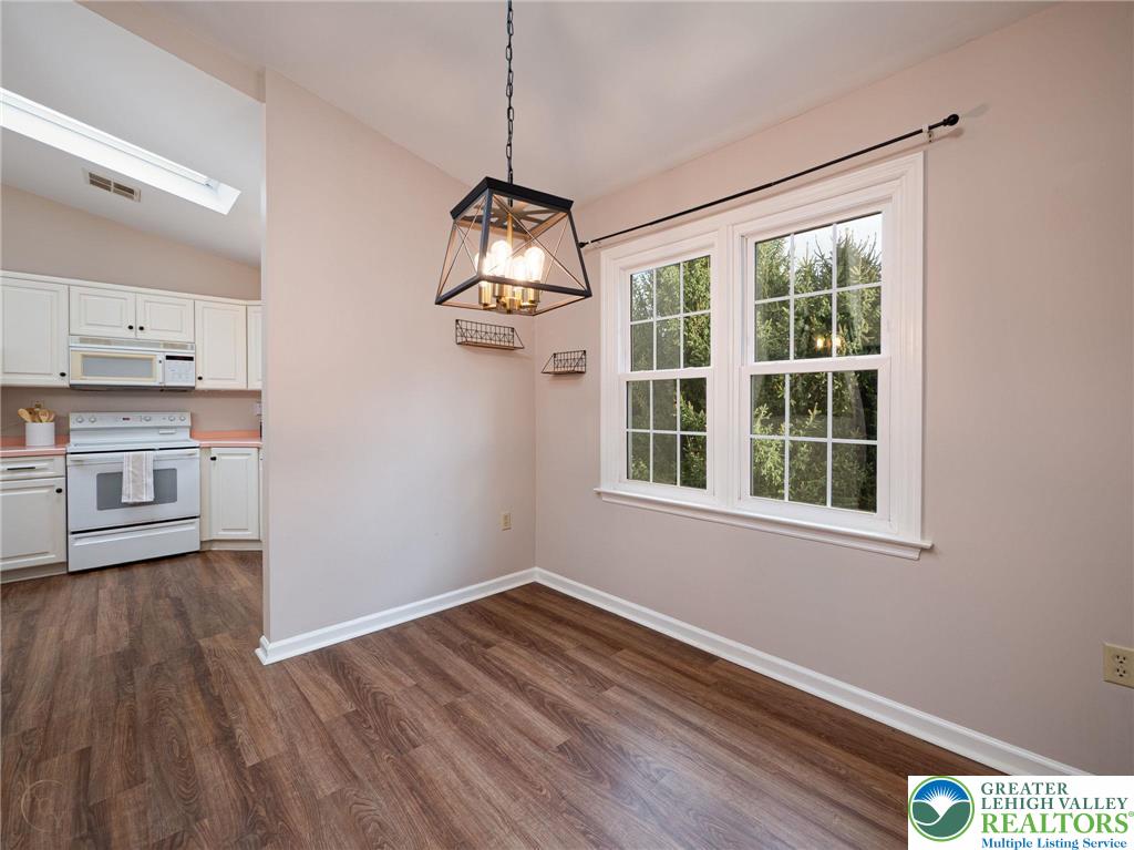 3217 Garfield Avenue, Unit E Reading, PA 19605 - Photo 14 of 45 a view of empty room with wooden floor and window