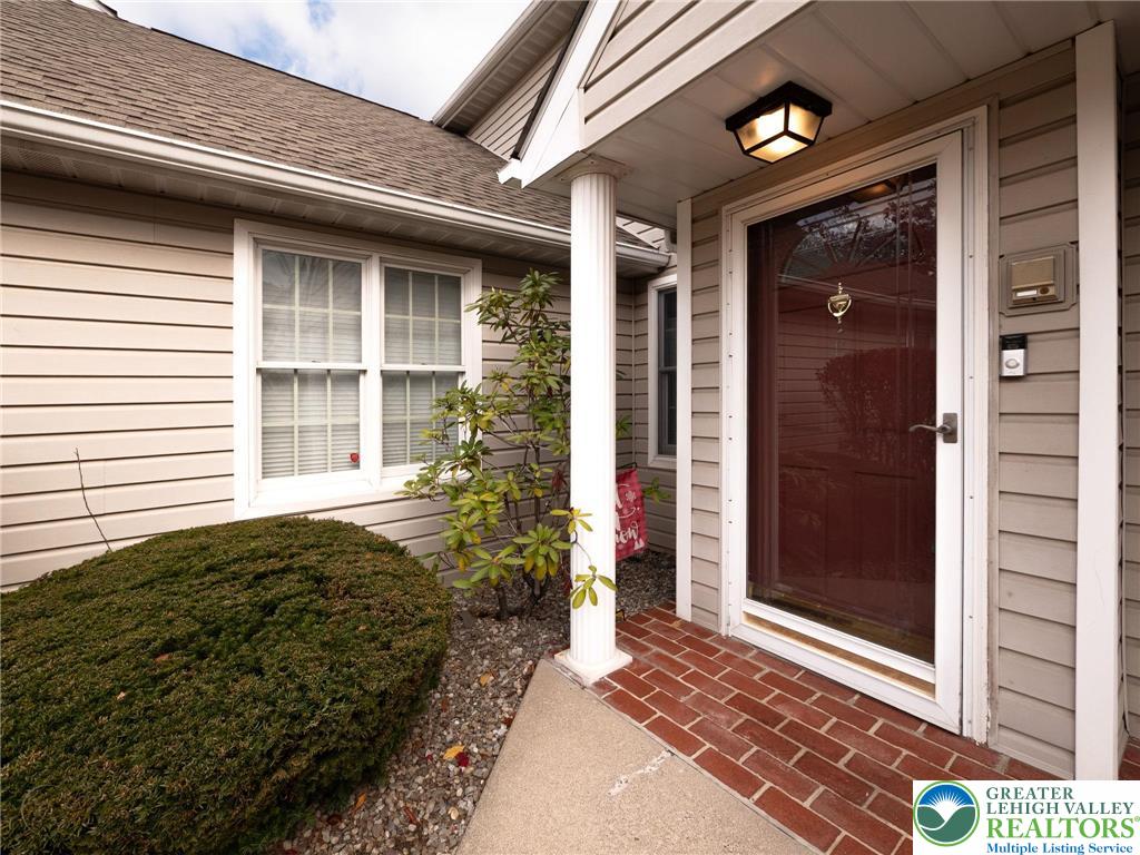 3217 Garfield Avenue, Unit E Reading, PA 19605 - Photo 2 of 45 a front view of a house with a yard