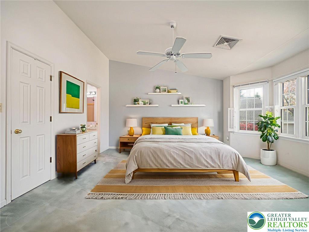 3217 Garfield Avenue, Unit E Reading, PA 19605 - Photo 22 of 45 a bedroom with a bed and a couch