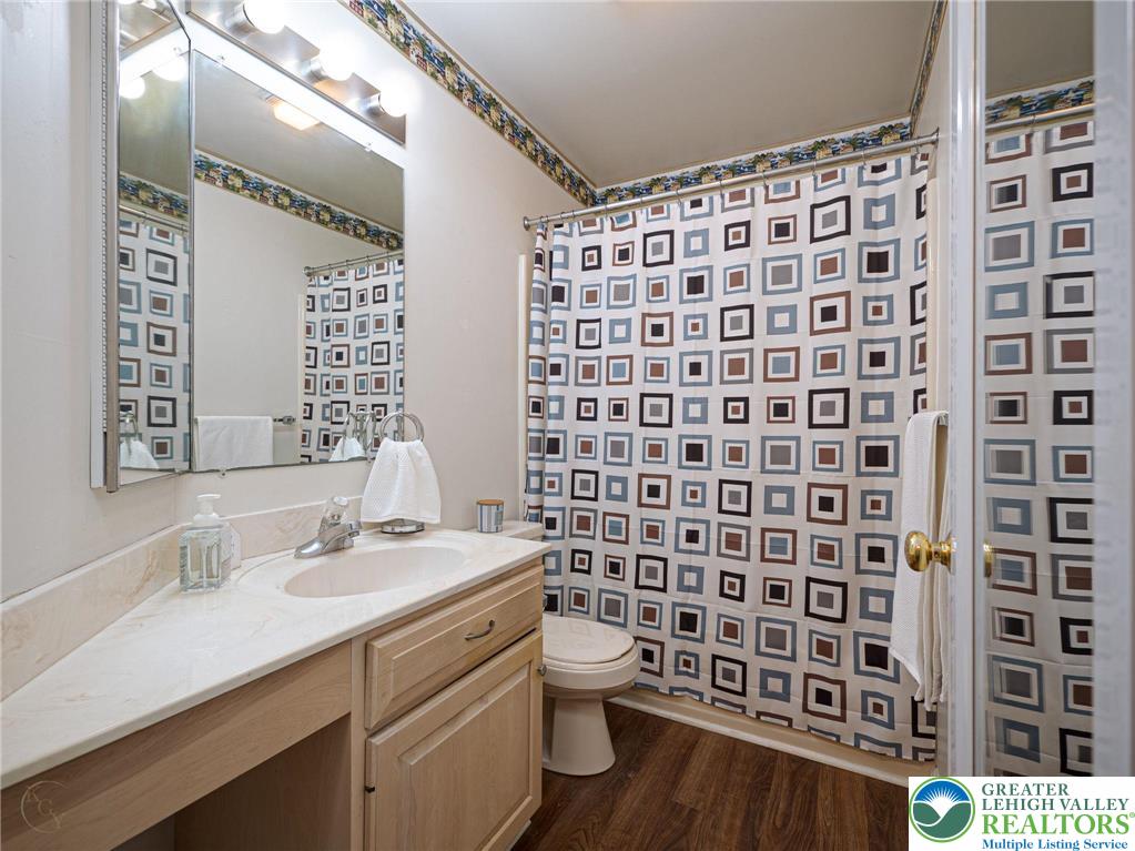 3217 Garfield Avenue, Unit E Reading, PA 19605 - Photo 30 of 45 a bathroom with a double vanity sink toilet and shower