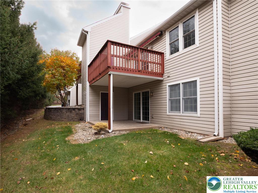 3217 Garfield Avenue, Unit E Reading, PA 19605 - Photo 35 of 45 a view of a house with a small yard and a large window