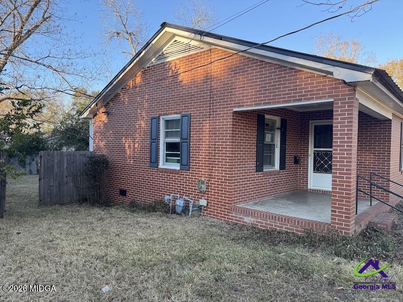 151 Edmondson Circle Cochran, GA 31014 - Photo 9 of 16 a front view of a house with garden