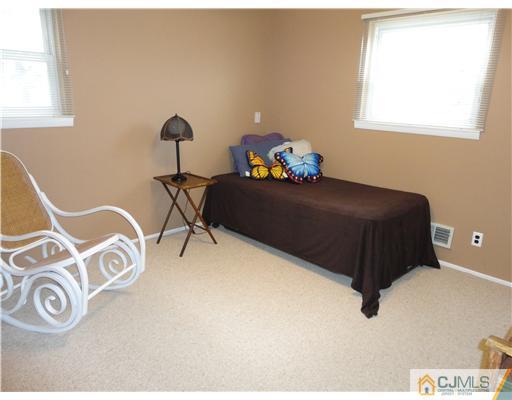 22 Innes Road East Brunswick, NJ 08816 - Photo 15 of 18 a bedroom with a bed and a window