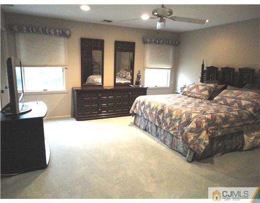 22 Innes Road East Brunswick, NJ 08816 - Photo 7 of 18 a bed room with a bed mirror and window