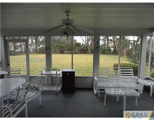 22 Innes Road East Brunswick, NJ 08816 - Photo 9 of 18 a view of a floor to ceiling window and a table