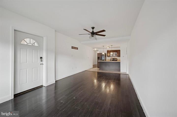 2467 79th Avenue, Unit 1 Philadelphia, PA 19150 - Photo 4 of 16 an empty room with wooden floor and windows
