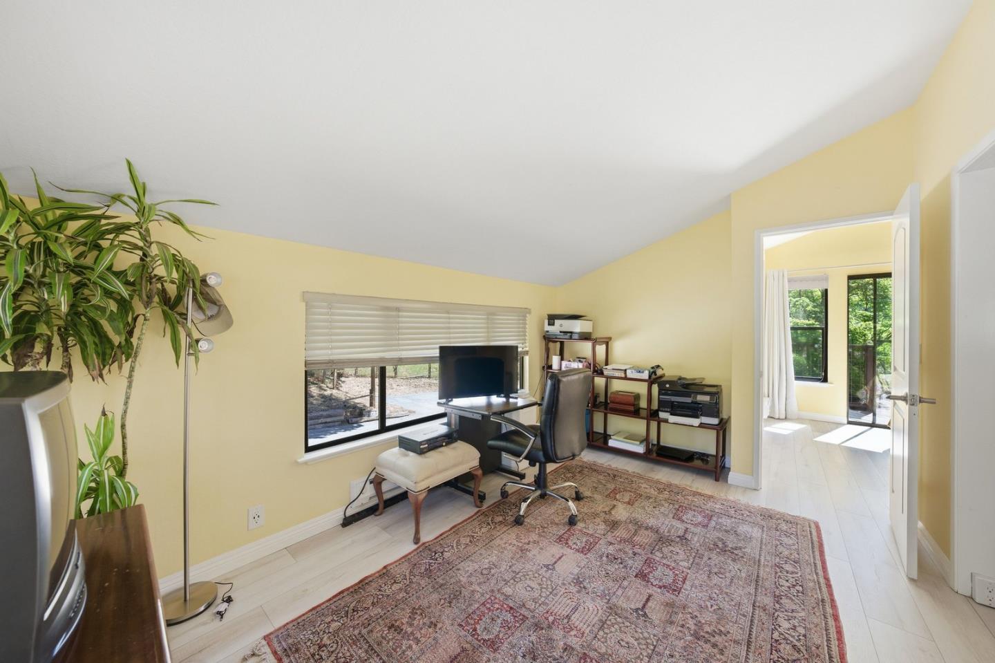 701 Day Valley Road Aptos, CA 95003 - Photo 27 of 43 a living room with furniture and a flat screen tv