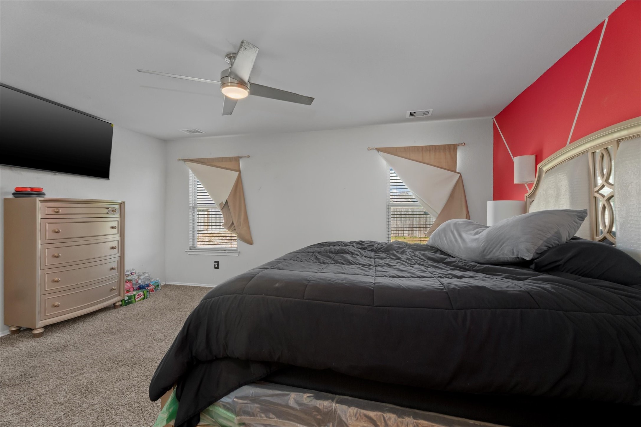 2602 Lincolns Meadow Drive Spring, TX 77373 - Photo 19 of 39 a bedroom with a bed and a flat screen tv
