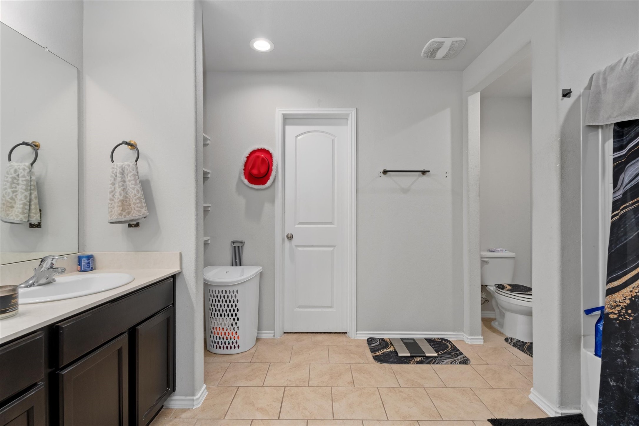 2602 Lincolns Meadow Drive Spring, TX 77373 - Photo 22 of 39 a bathroom with a sink a toilet and a mirror
