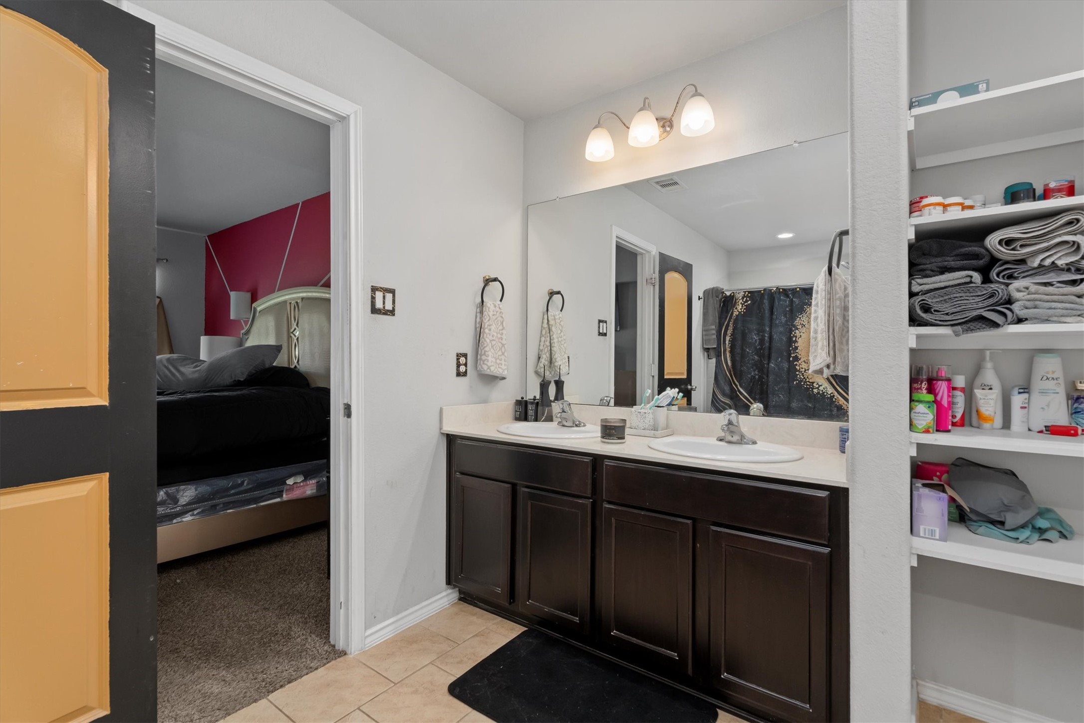 2602 Lincolns Meadow Drive Spring, TX 77373 - Photo 29 of 39 a en suite bathroom with a double vanity sink and a mirror