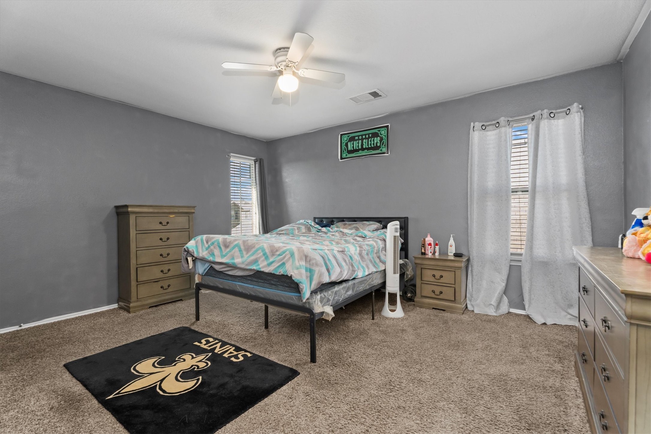 2602 Lincolns Meadow Drive Spring, TX 77373 - Photo 34 of 39 a bed sitting in a bedroom next to a window