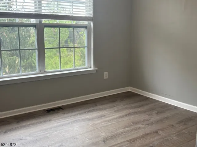 a bathroom with a sink vanity mirror toilet and bathtub