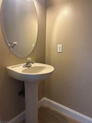 a bathroom with a sink and mirror