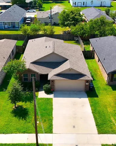 an aerial view of a house having yard