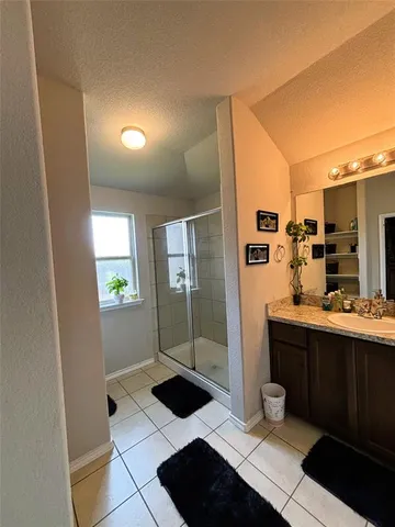 a bedroom with furniture and a chandelier