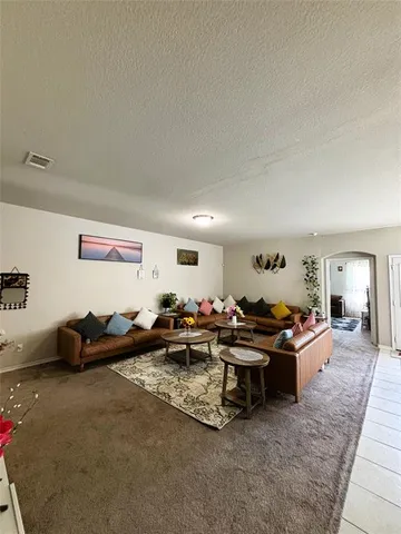 a living room with furniture and a couch