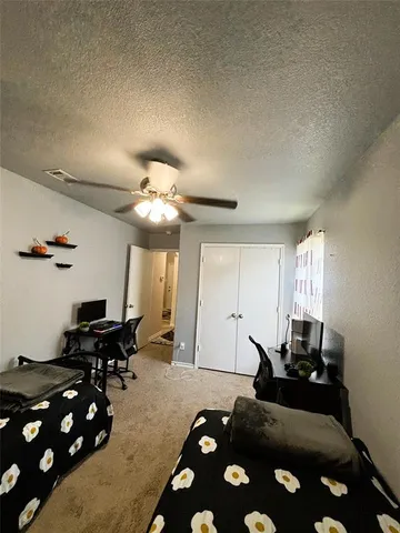 a hallway with a large mirror and furniture
