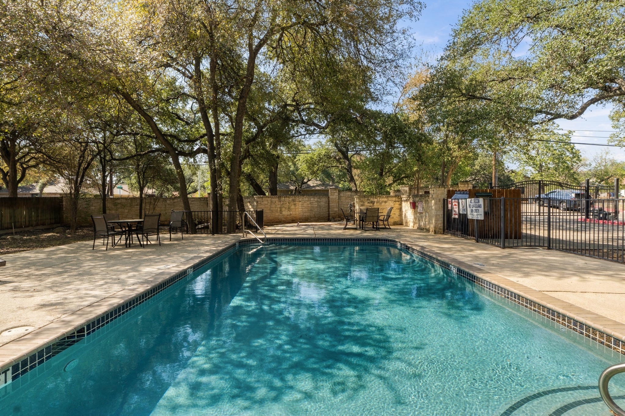 4508 Duval Road, Unit 604 Austin, TX 78727 - Photo 28 of 34 Take a sunny afternoon off to relax by the community pool, which was fully refurbished by the HOA (summer 2025) and offers a great place to meet neighbors