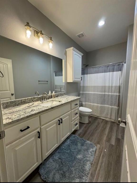 306 Embraer Road Abilene, TX 79602 - Photo 13 of 19 a bathroom with a granite countertop sink toilet and shower