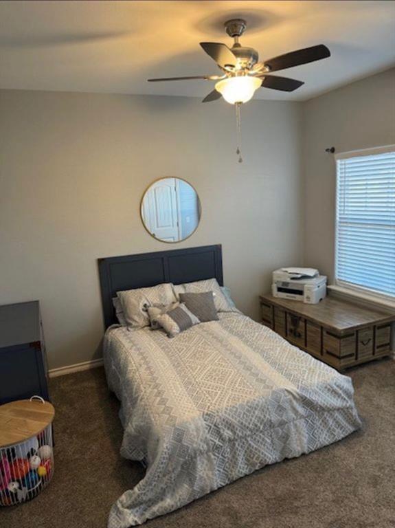 306 Embraer Road Abilene, TX 79602 - Photo 16 of 19 a bedroom with a bed and a chandelier