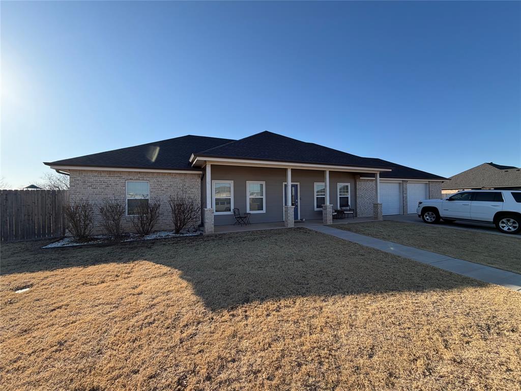 306 Embraer Road Abilene, TX 79602 - Photo 2 of 19 a front view of a house with a yard and garage