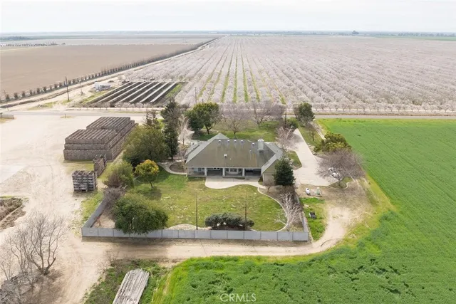 an aerial view of residential houses with outdoor space and swimming pool