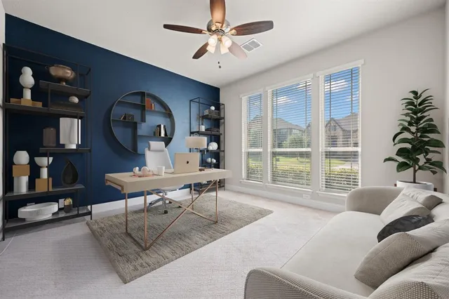 a view of an empty room with a window and a kitchen