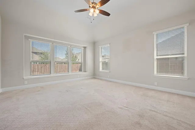 a view of empty room with fan