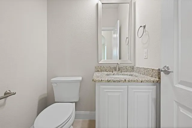 a view of an empty room with a fan