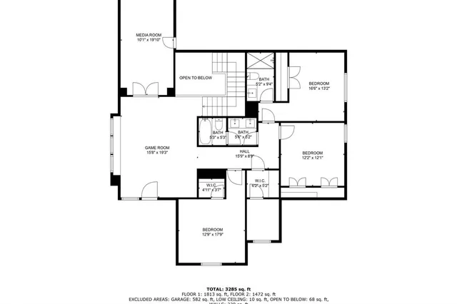 a kitchen with stainless steel appliances a stove microwave and cabinets