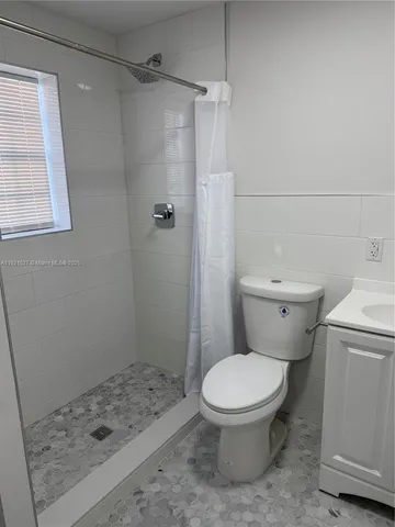 a view of storage and utility room with washer and dryer