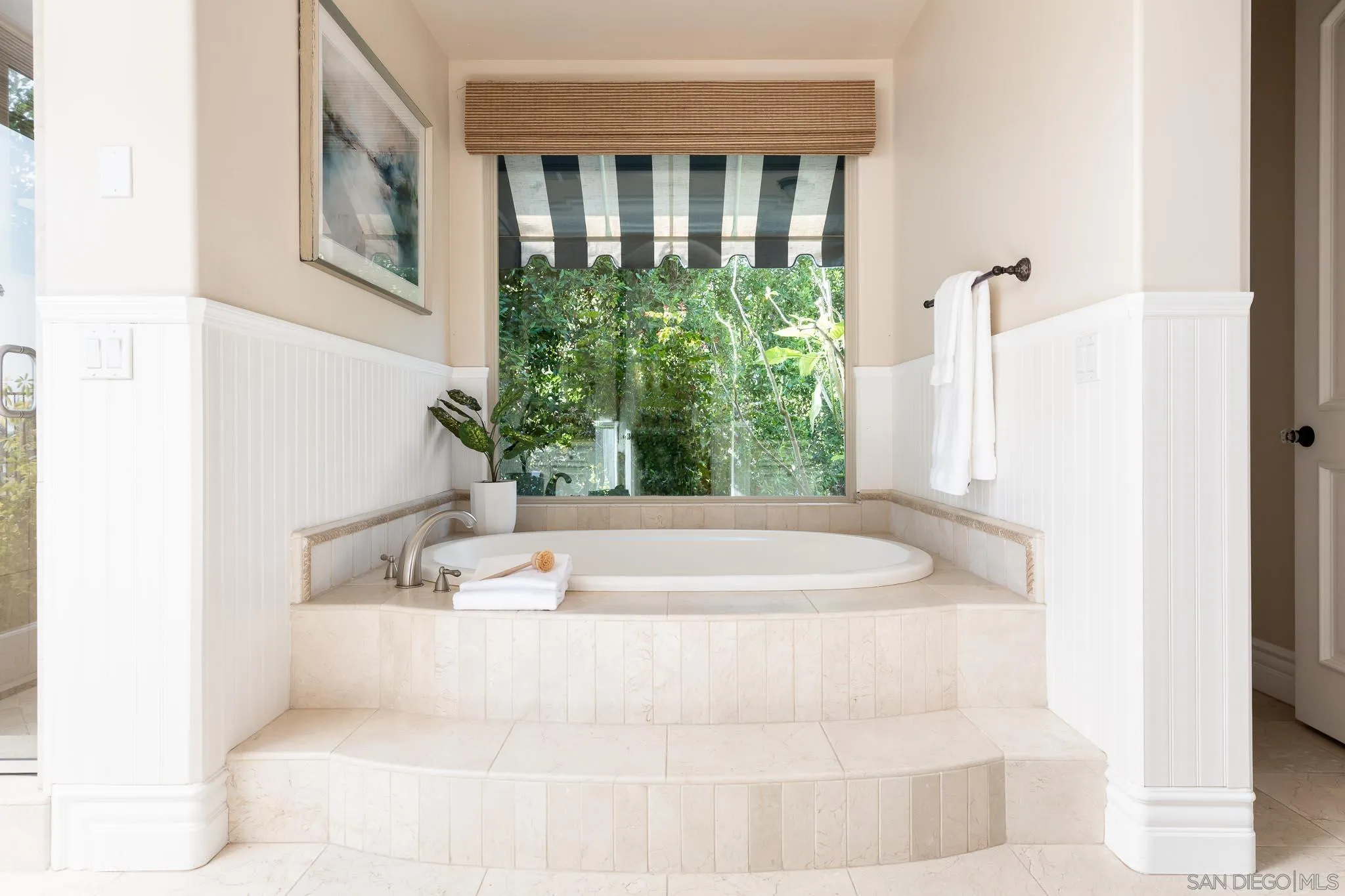 15435 Eastvale Road Poway, CA 92064 - Photo 17 of 57 a white bath tub sitting in a bathroom