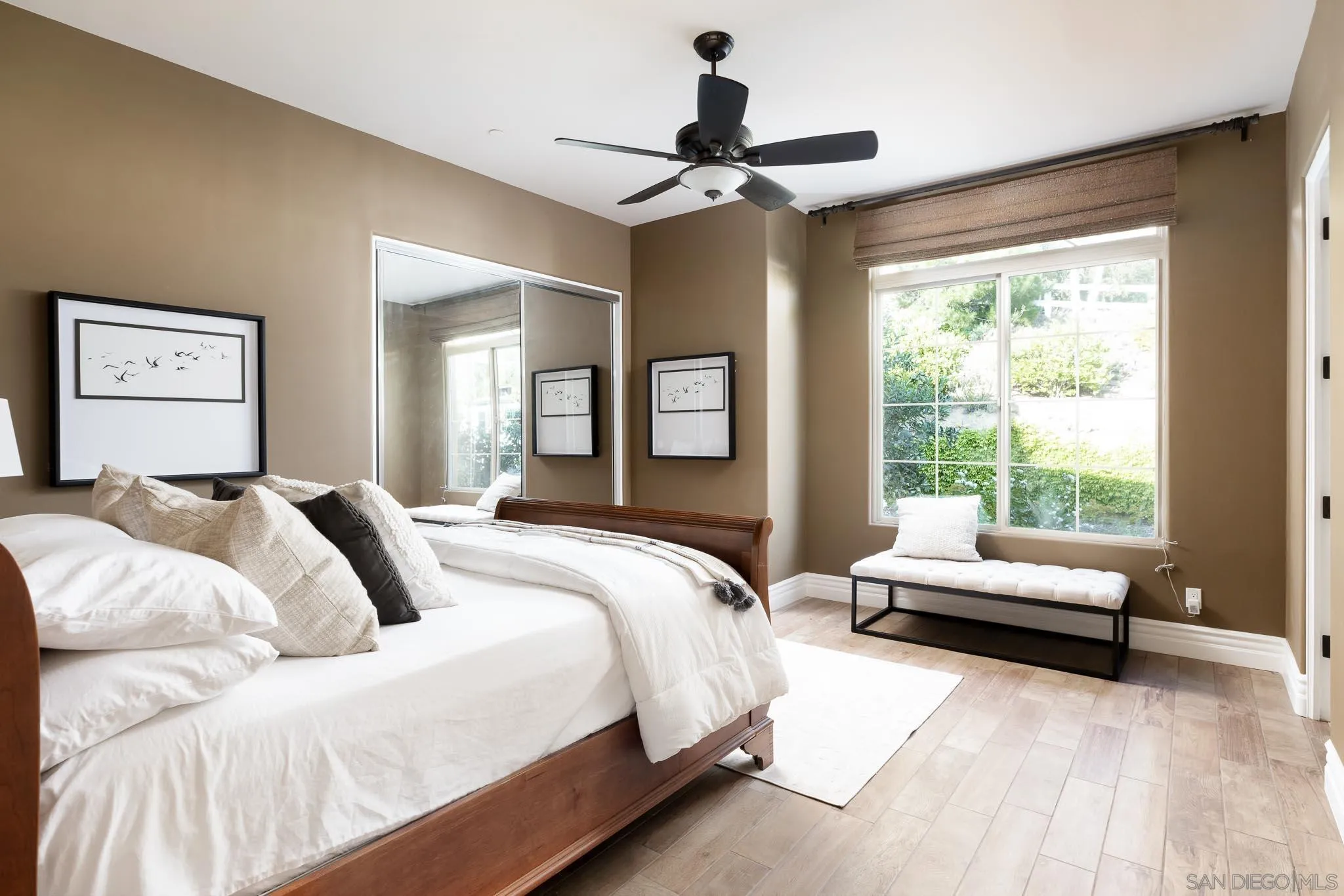 15435 Eastvale Road Poway, CA 92064 - Photo 24 of 57 a bed room with a bed and a chandelier