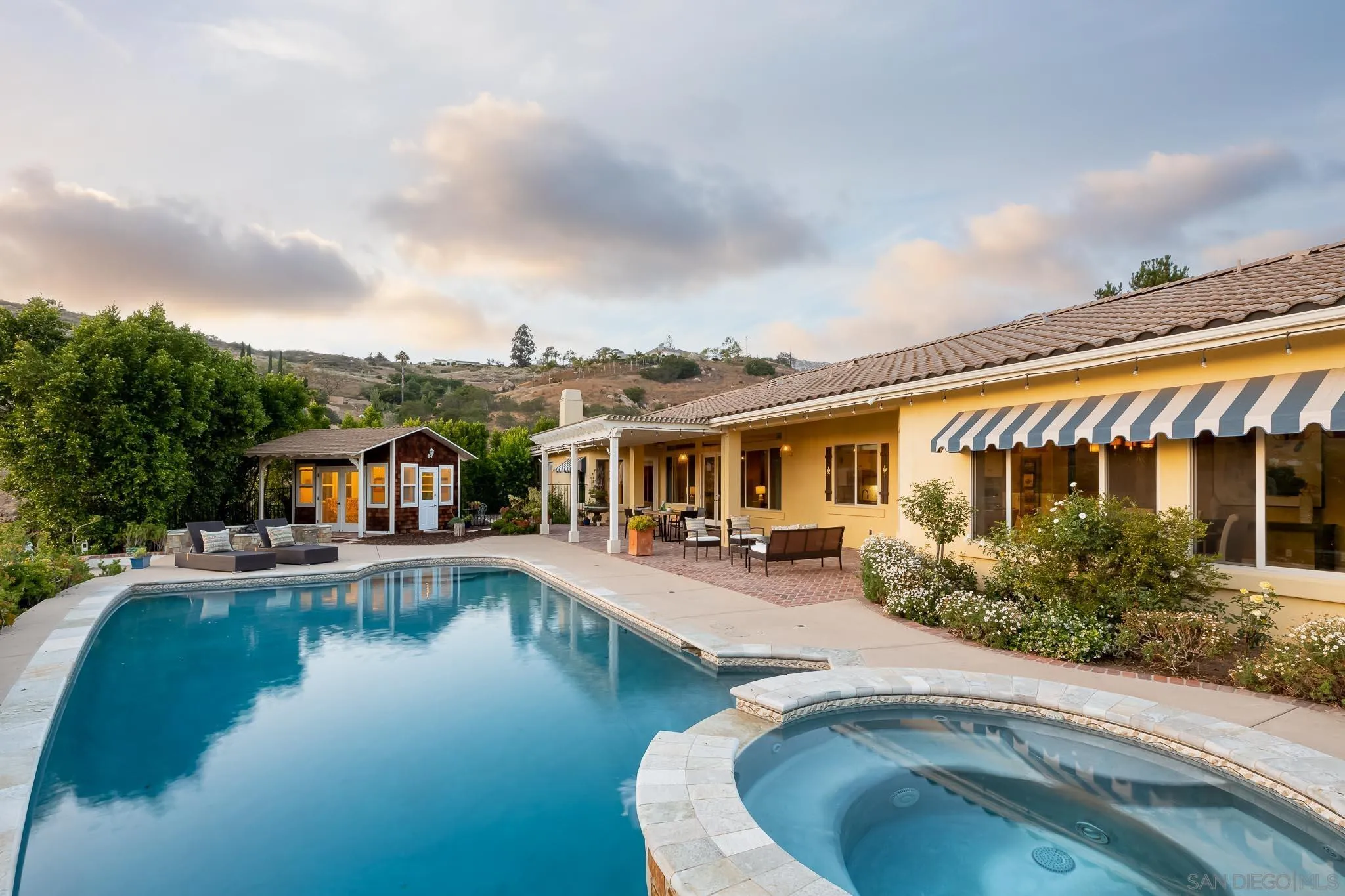 15435 Eastvale Road Poway, CA 92064 - Photo 31 of 57 a house with swimming pool in front of it