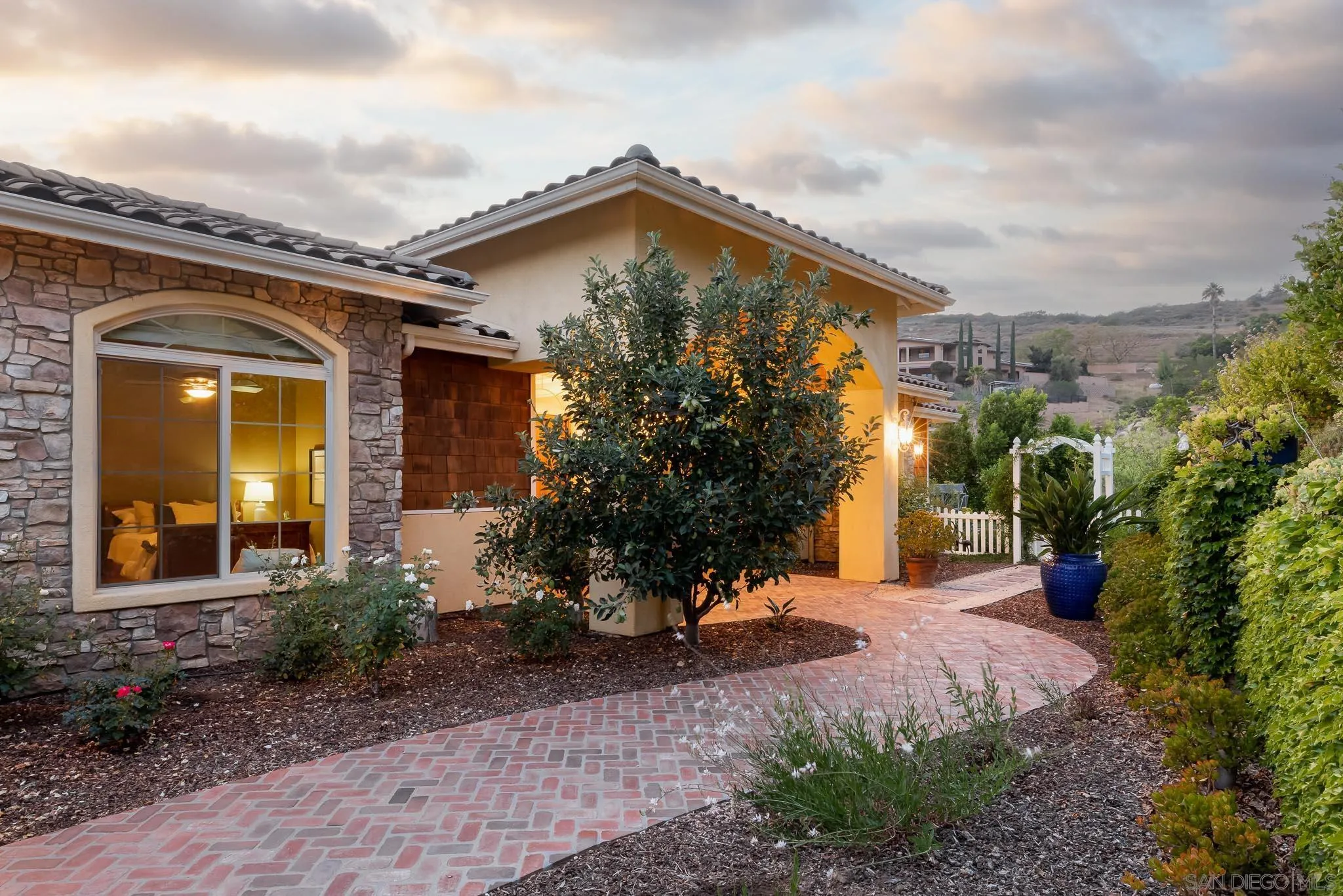 15435 Eastvale Road Poway, CA 92064 - Photo 34 of 57 a view of a house with a yard