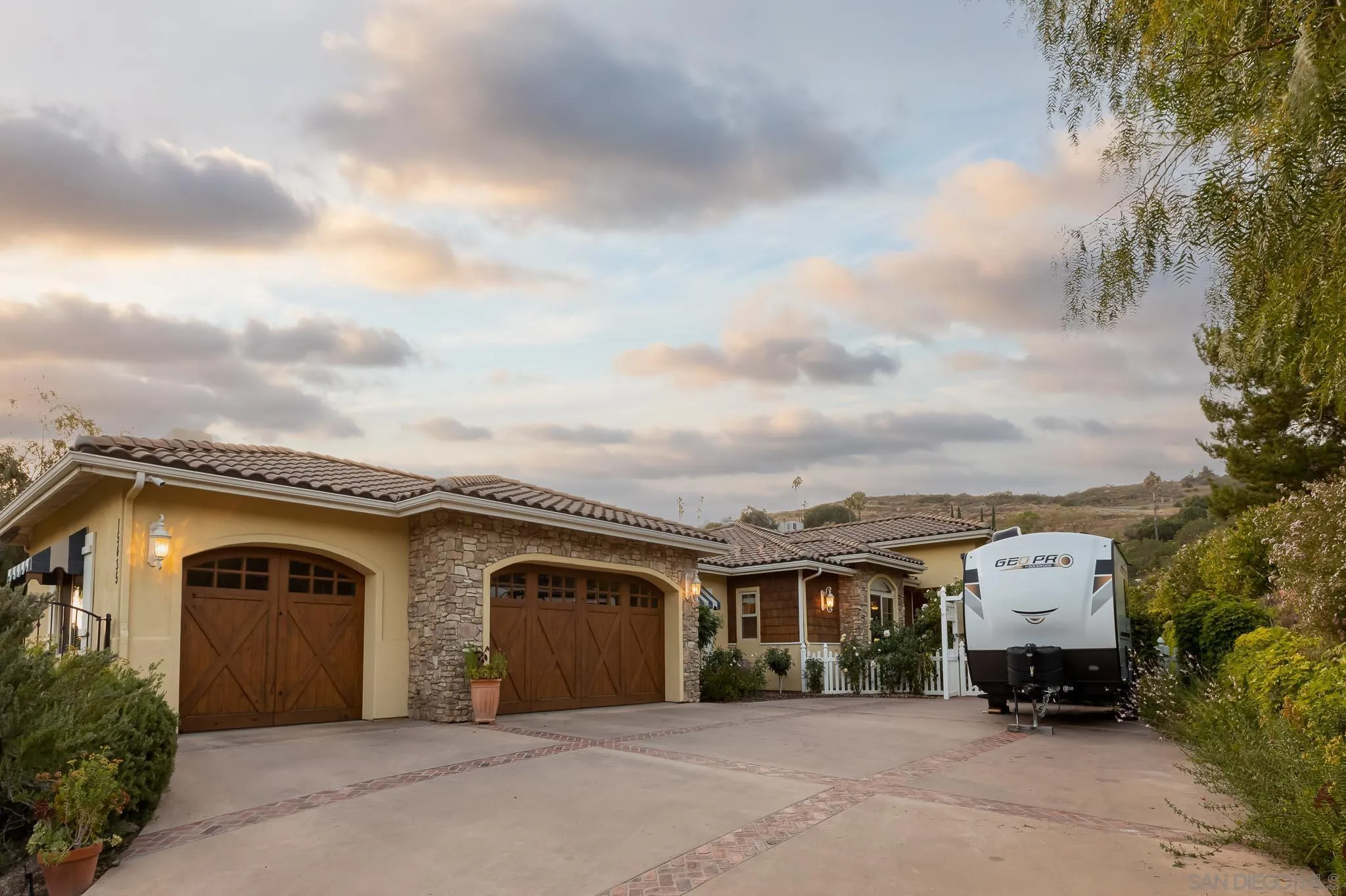 15435 Eastvale Road Poway, CA 92064 - Photo 35 of 57 a front view of a house with a yard