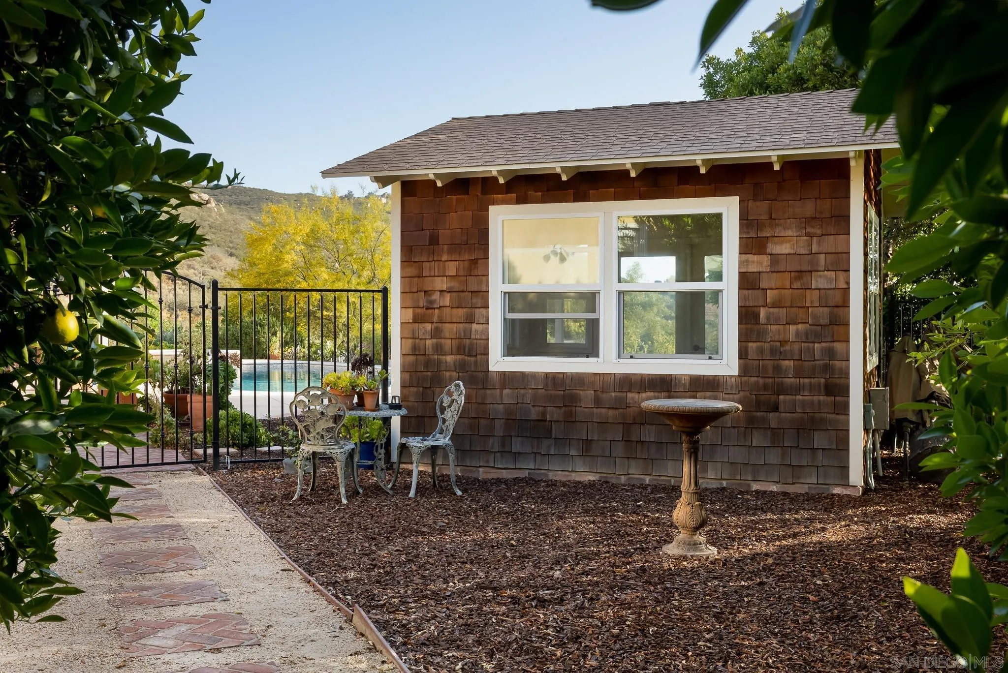 15435 Eastvale Road Poway, CA 92064 - Photo 39 of 57 a front view of a house with outdoor seating
