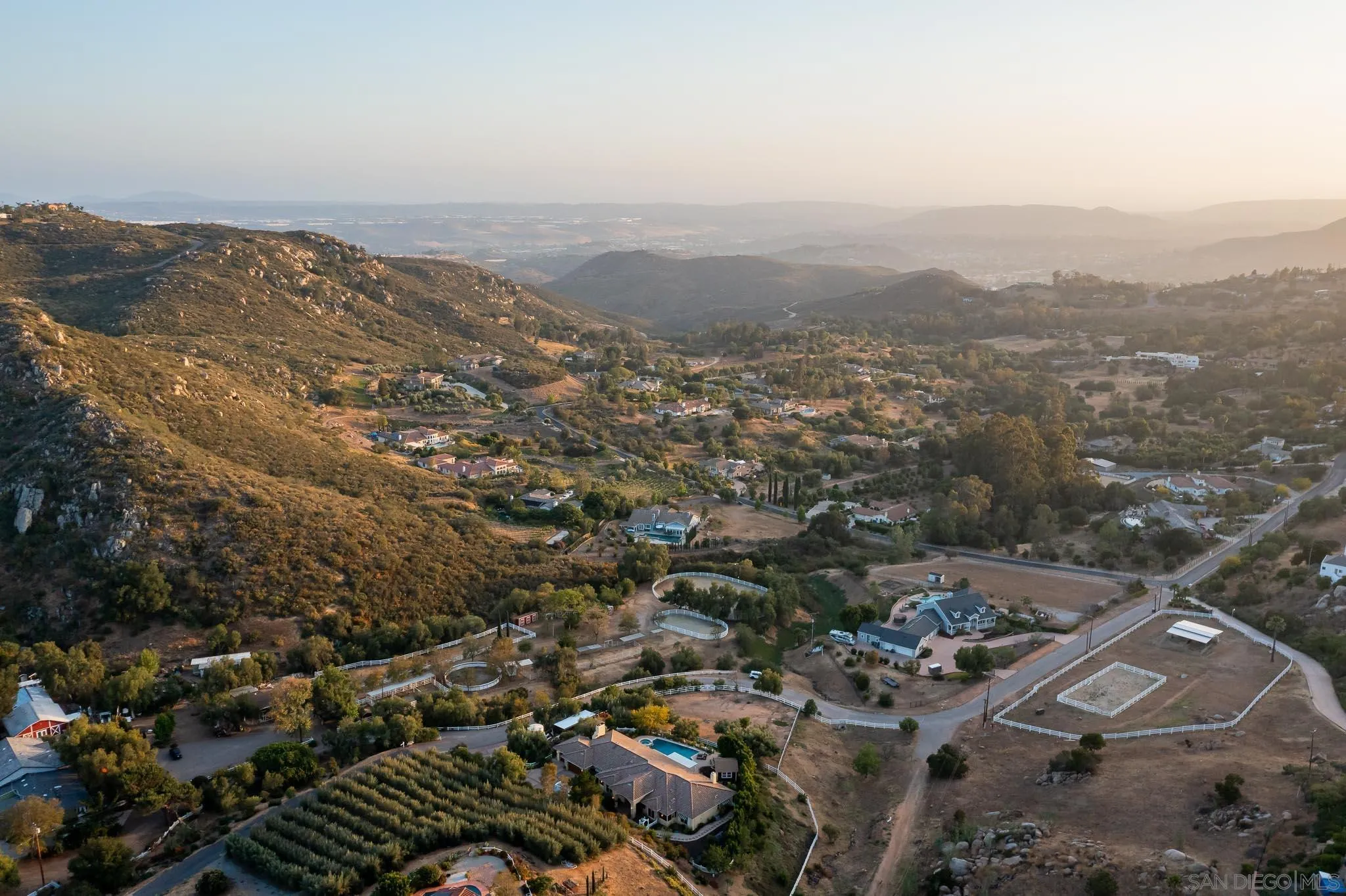 15435 Eastvale Road Poway, CA 92064 - Photo 53 of 57 an aerial view of house with yard and mountain view in back